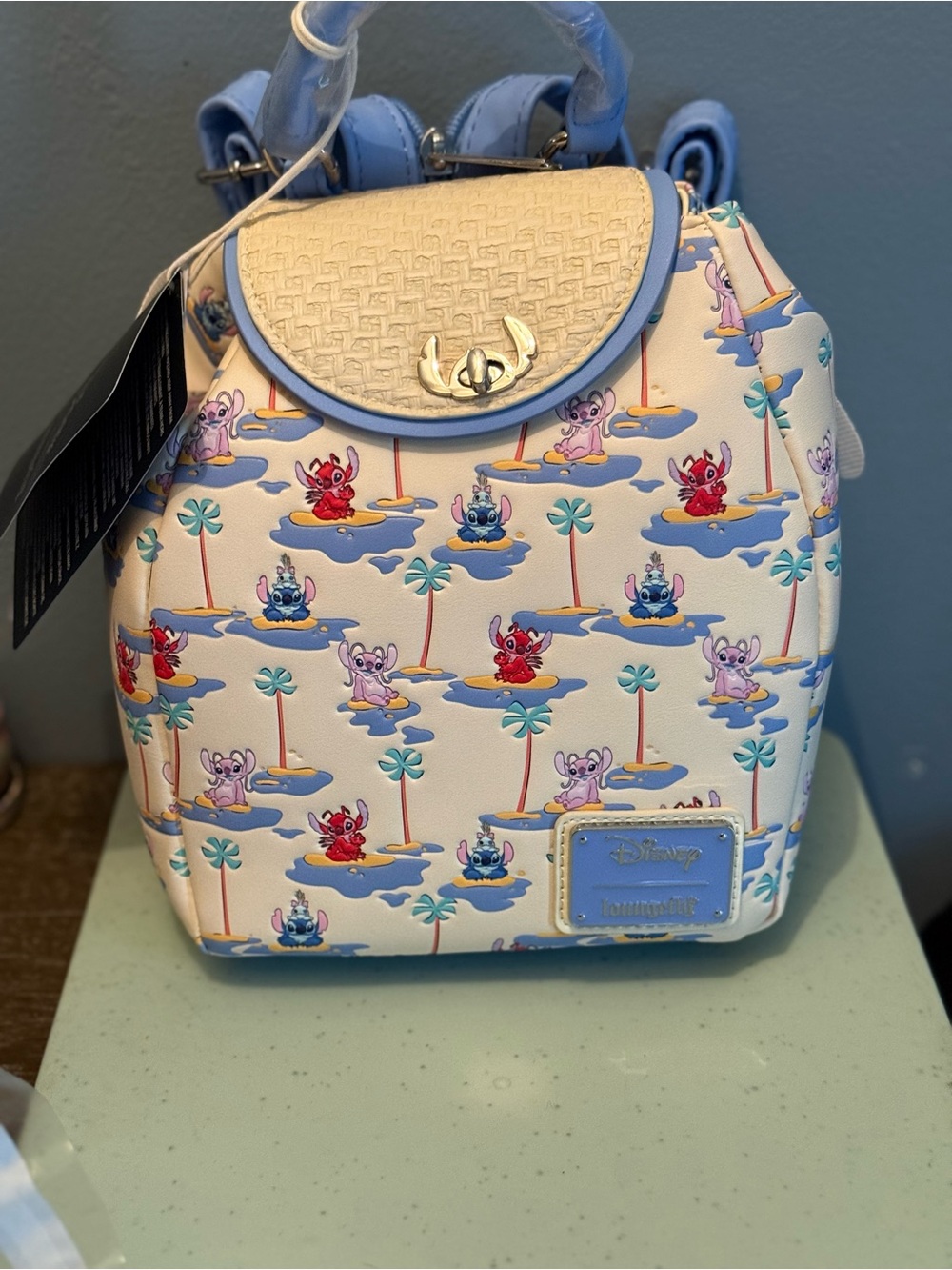 Loungefly Cream Mini Backpack with Blue Trim and Multi-Color Lilo & Stitch Print